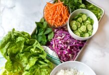 sheet pan with ingredients to assemble summer roll lettuce wraps